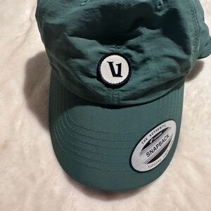 VUORI V1 Patch Hat SnapBack. Unisex. The color is Aspen.